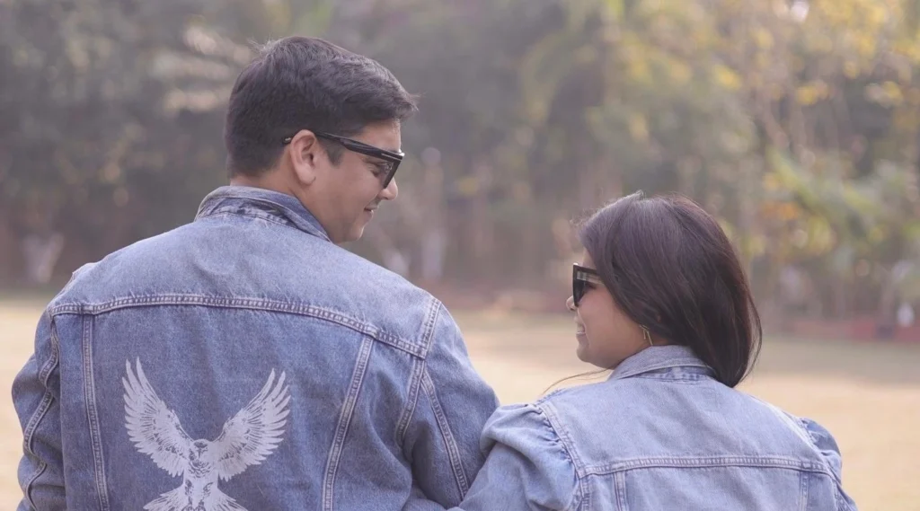 couple with diy art on denim jacket with artistic butterfly and eagle